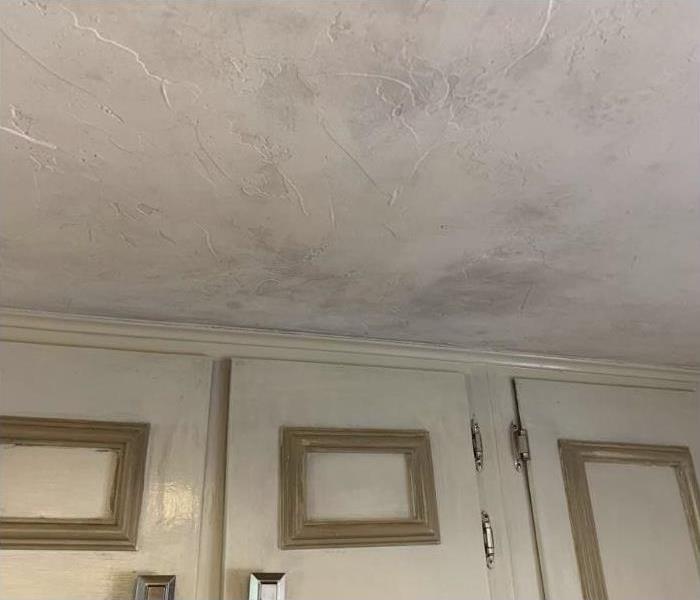 Smoke from a small kitchen fire on cabinets and ceiling