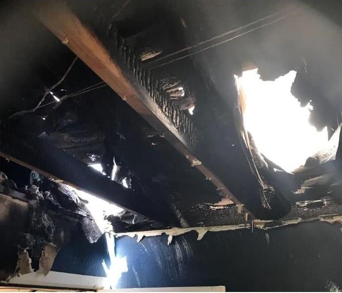 Small fire ruined the ceiling and roof in a residents living room